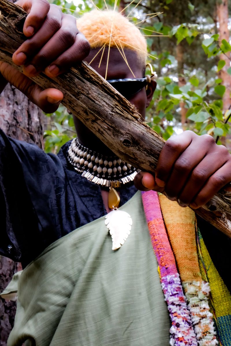 Model wearing a handwoven scarf and beaded jewellery