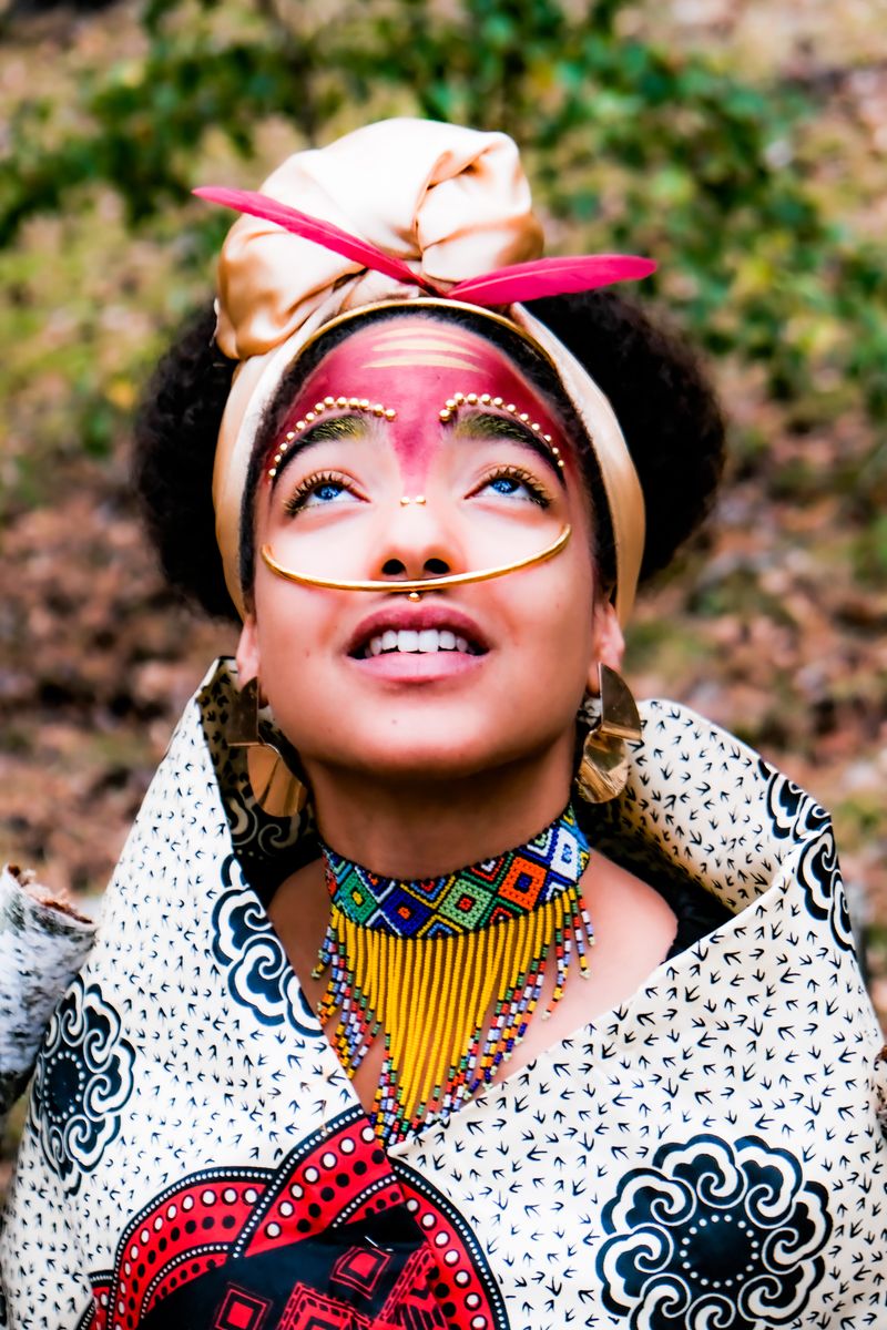 Headwrap, beaded collar and statement eyewear