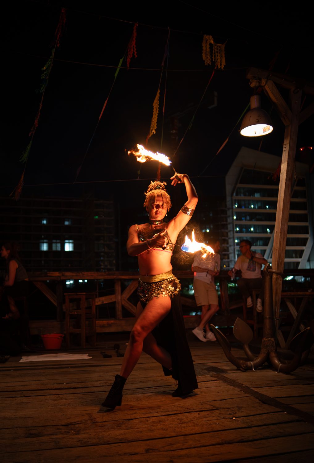 Backbend fire-fan pose with flames overhead