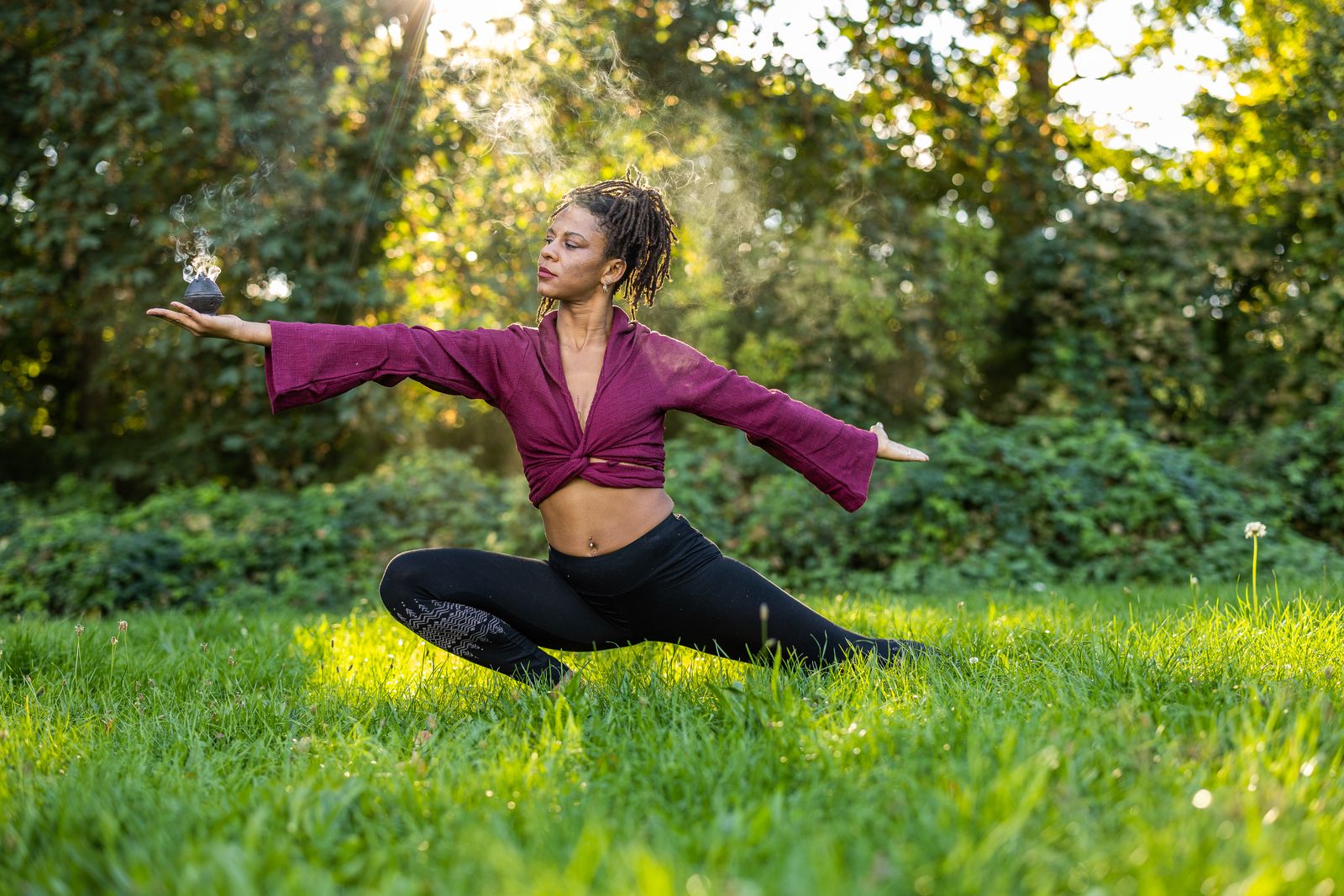 Movement and ritual flow in the grass holding an incense bowl