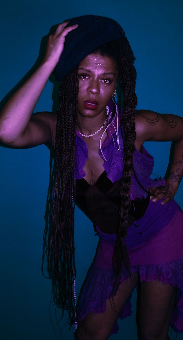 Purple-lit studio portrait
